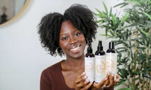 Afrocenchix How to do the PERFECT Twist out on Natural Hair, the final look: Beautiful black woman with afro hair twist out holding Afrocenchix products