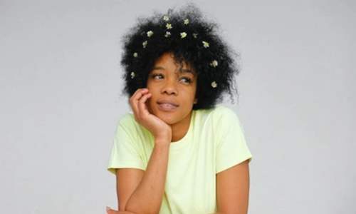 afro hair myths - afrocenchix blog -black woman with flowers in hair